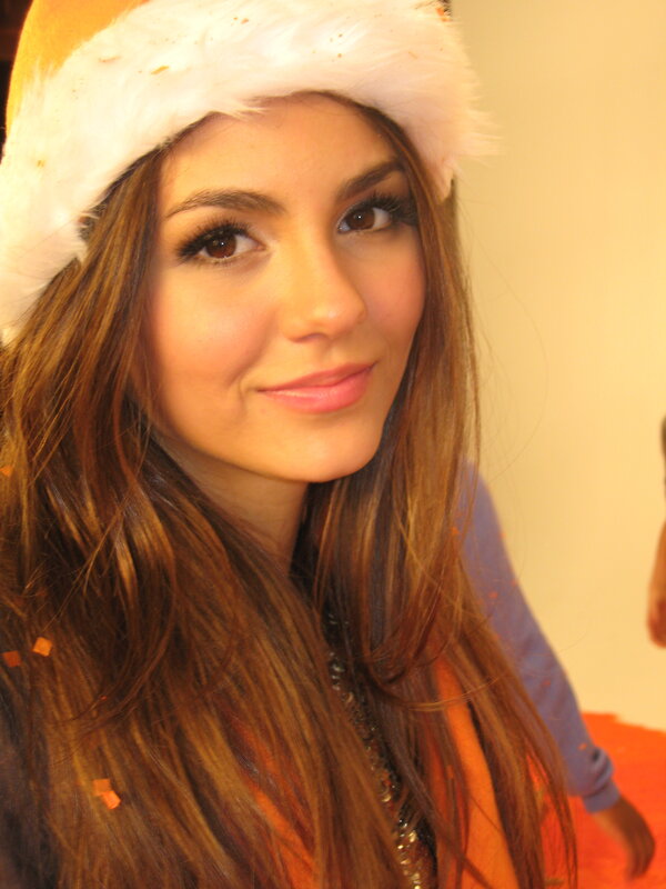 woman in santa hat smiling