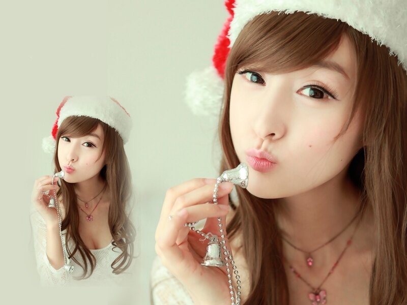 Woman in Santa hat with bell