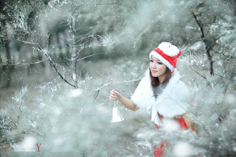 Woman in Santa hat with bell