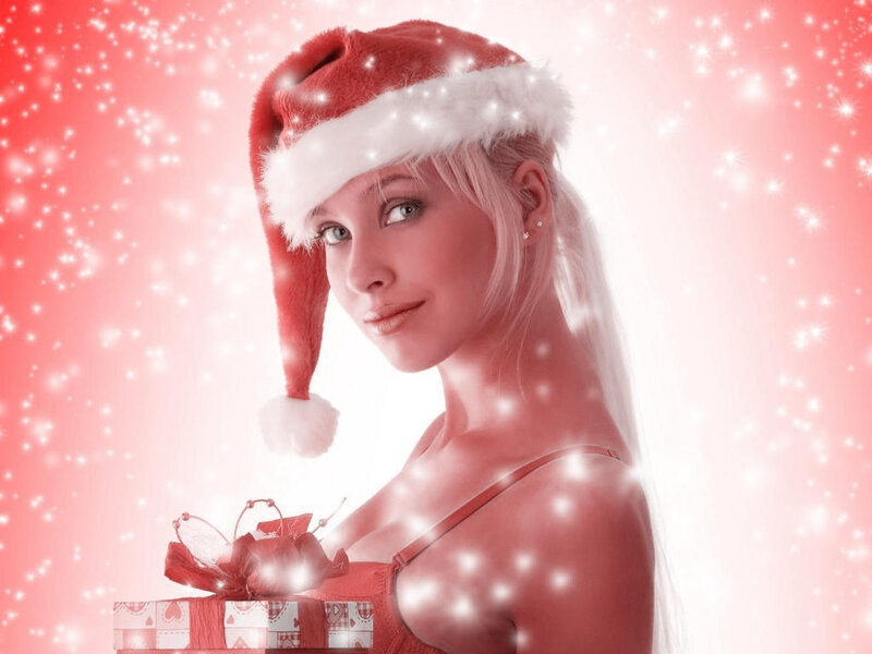 woman in santa hat with gift