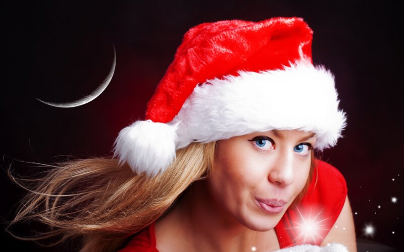 woman in santa hat with moon