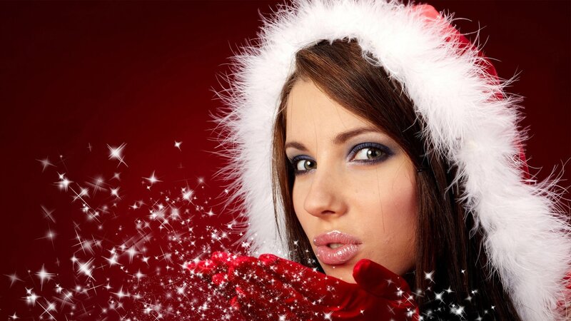 woman in santa hat with sparkles