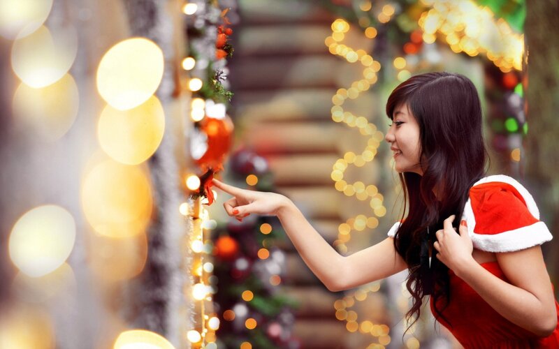 woman in santa outfit at christmas