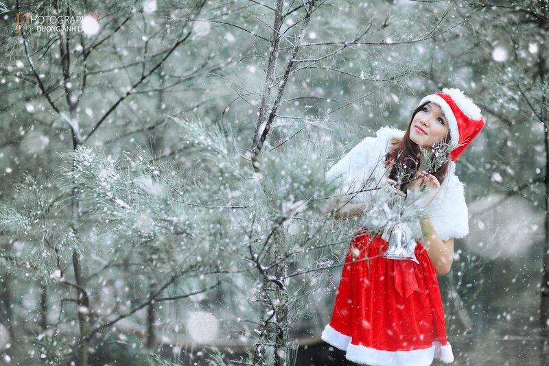 Woman in Santa outfit in snow
