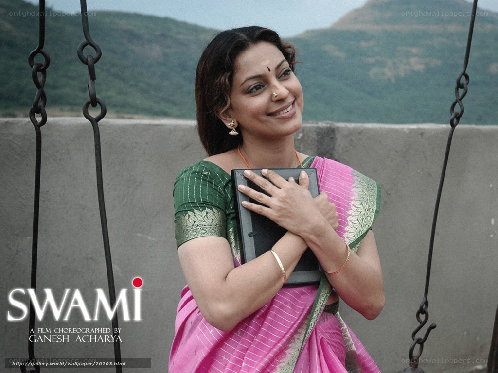 Woman in sari holding book