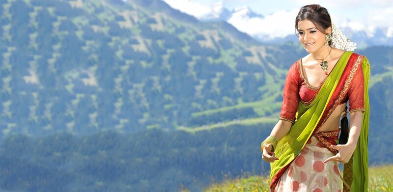Woman in sari on mountain landscape