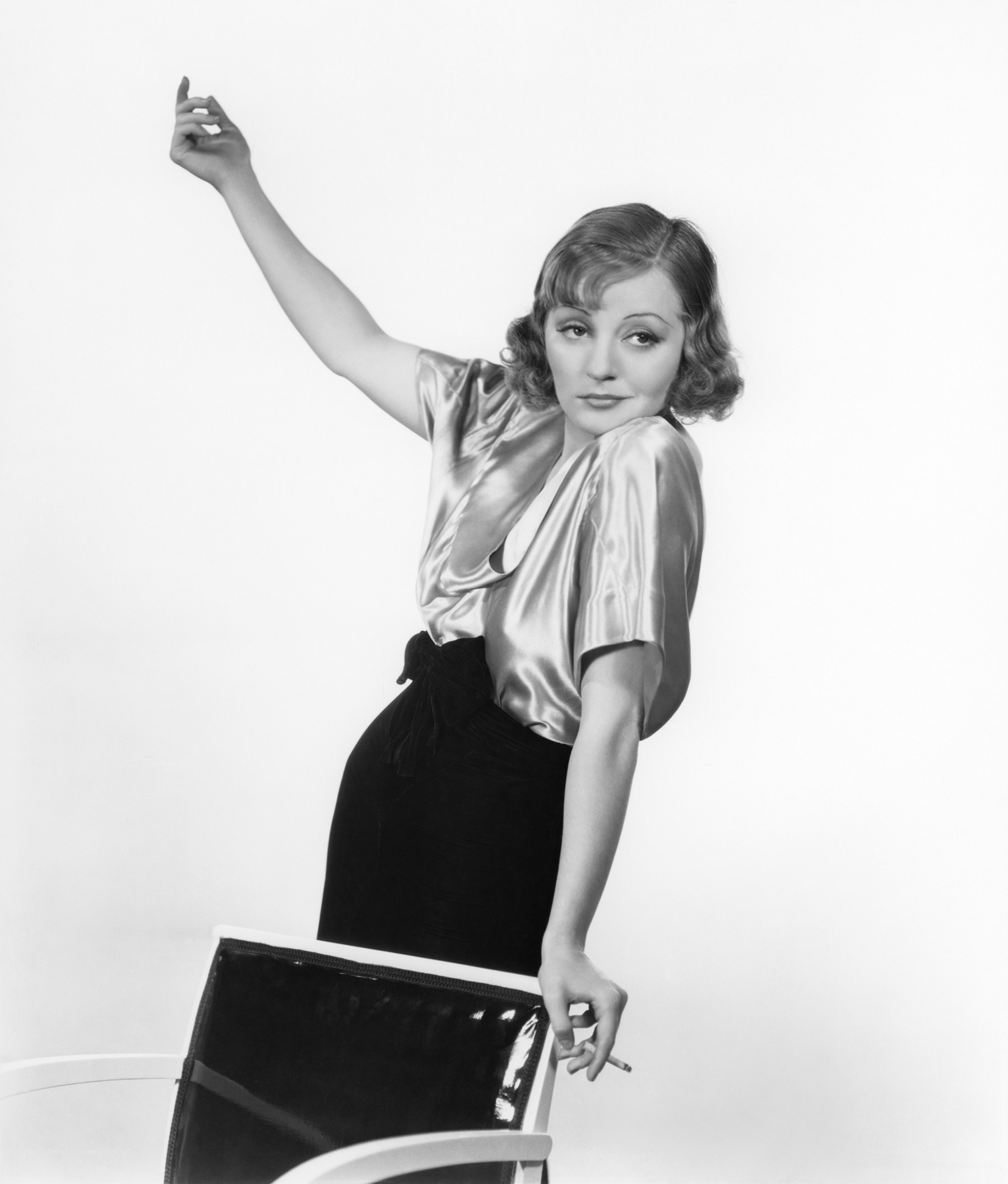 woman in satin blouse posing