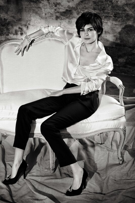woman in satin blouse sitting