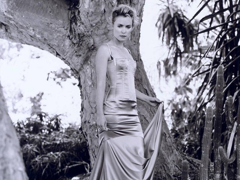 woman in satin dress by tree