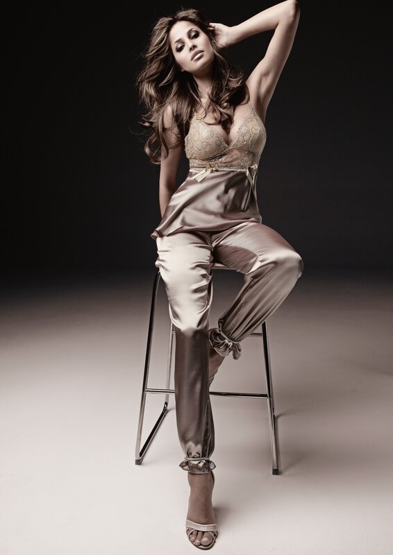 woman in satin pajamas on stool