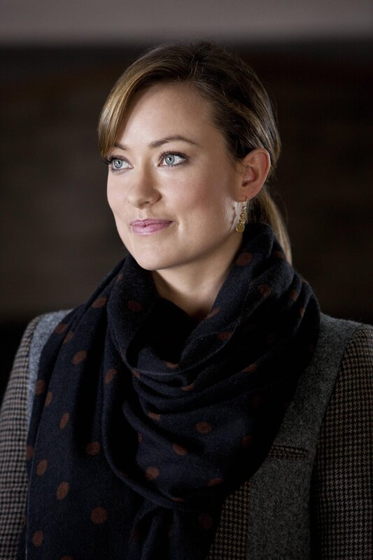 woman in scarf and vest