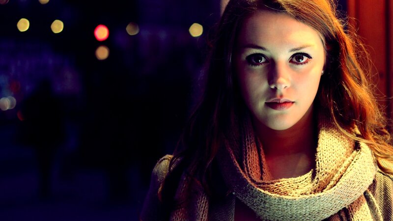 woman in scarf at night