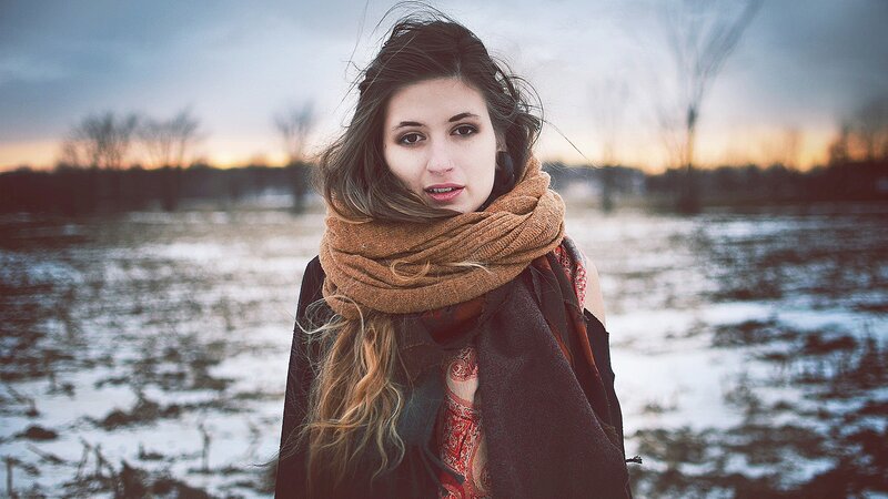 woman in scarf at sunset