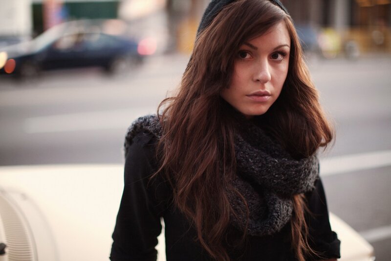 woman in scarf on city street