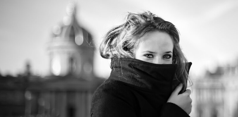 woman in scarf with city background