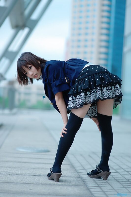 woman in school uniform bending