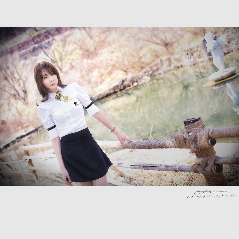 woman in school uniform by pond