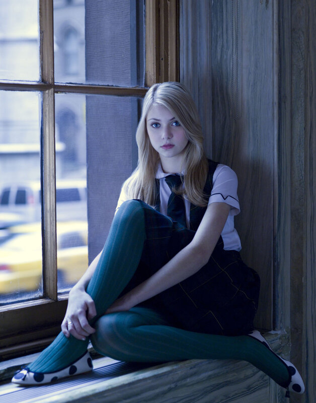 woman in school uniform by window