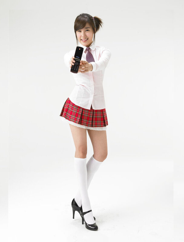woman in school uniform holding phone