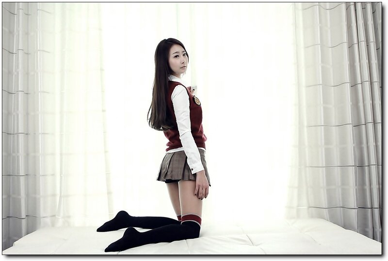 woman in school uniform kneeling
