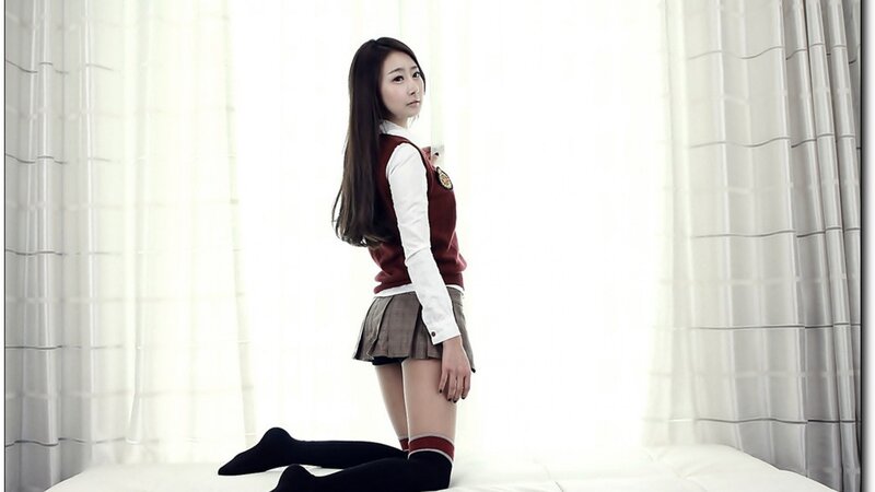 woman in school uniform kneeling