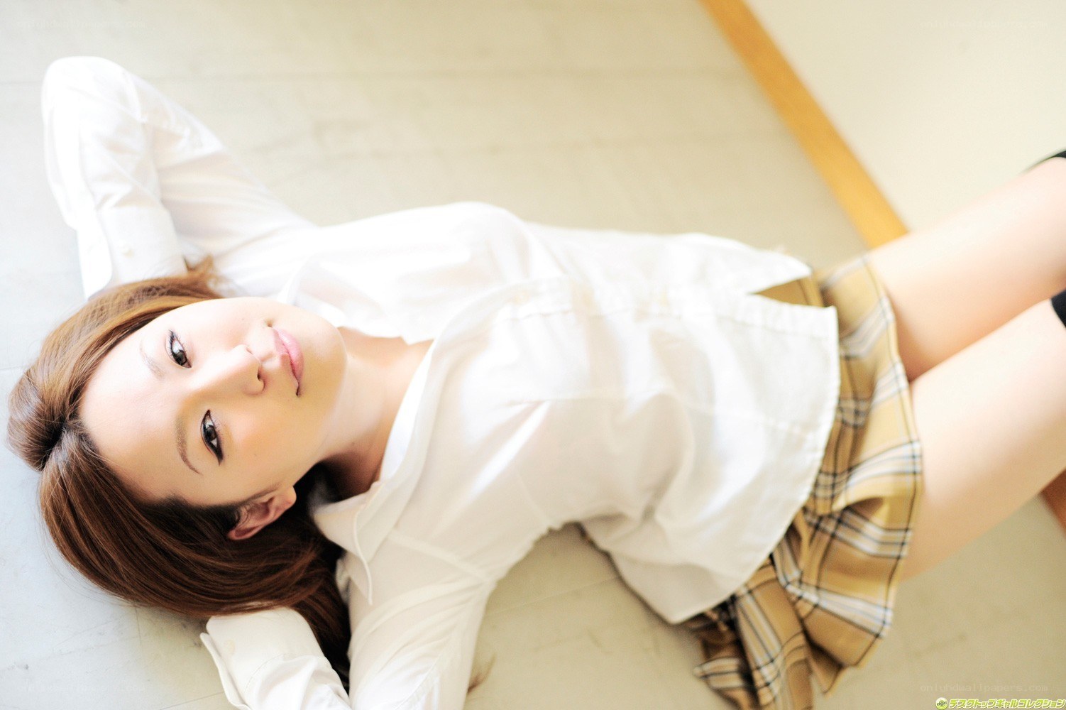 woman in school uniform lying down