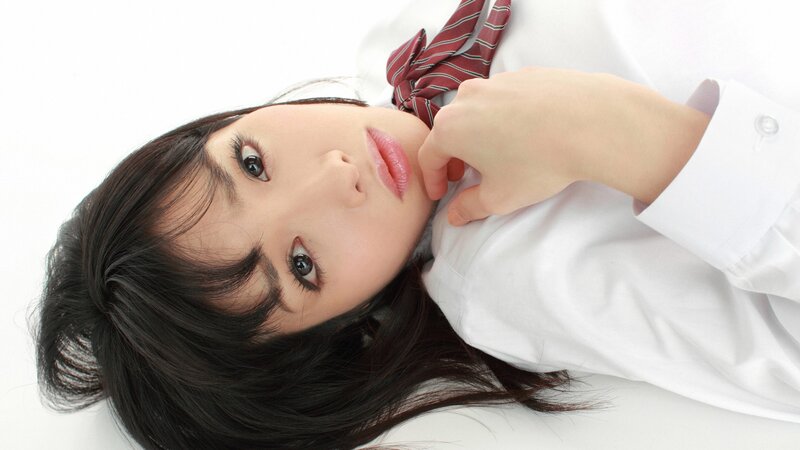 woman in school uniform lying down
