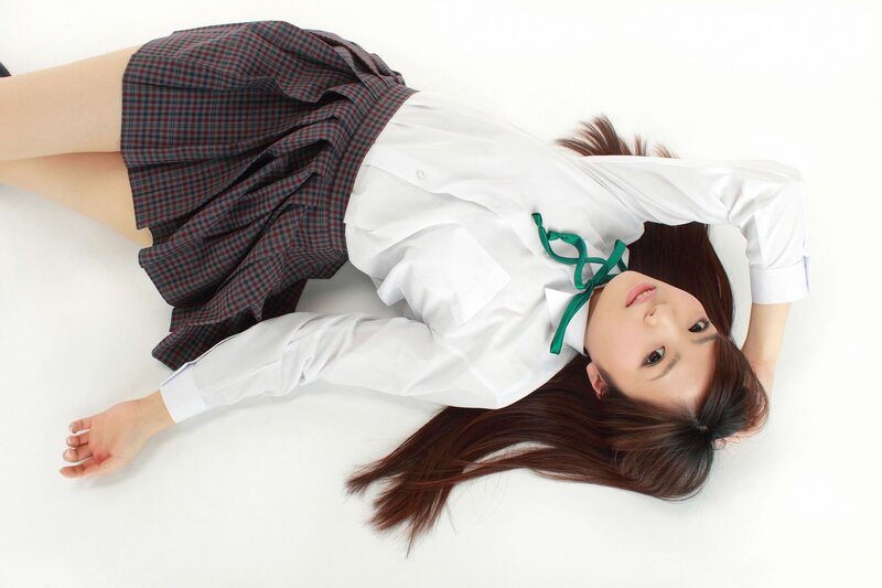 woman in school uniform lying down
