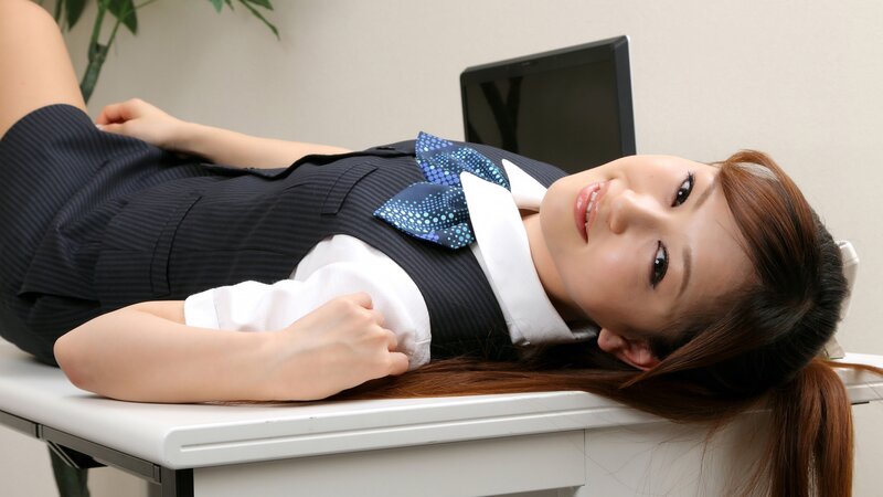 woman in school uniform lying on desk