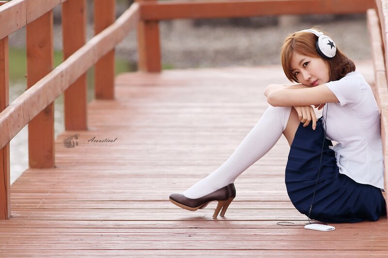 woman in school uniform on bridge