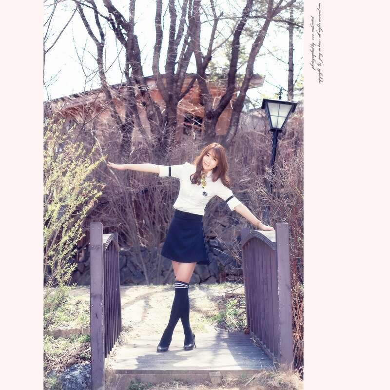 woman in school uniform on bridge
