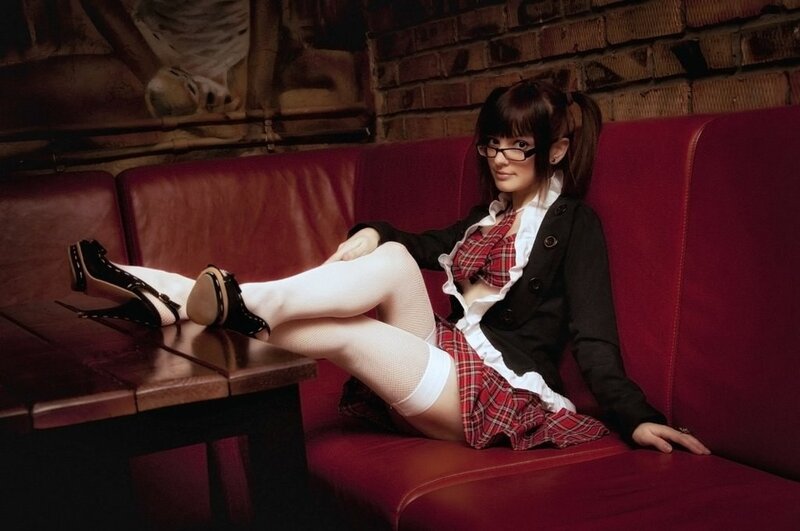 Woman in school uniform on couch