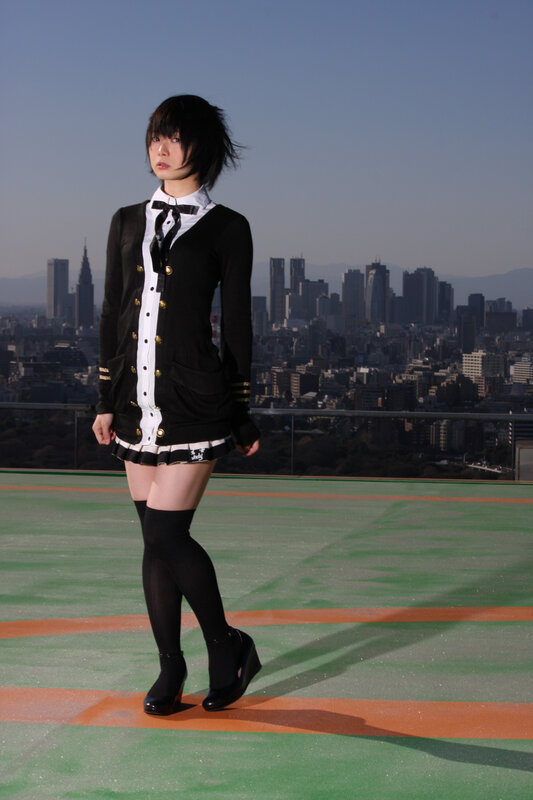 woman in school uniform on rooftop