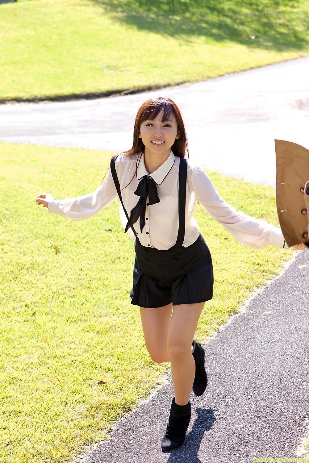 woman in school uniform running