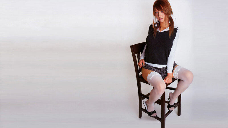 woman in school uniform sitting
