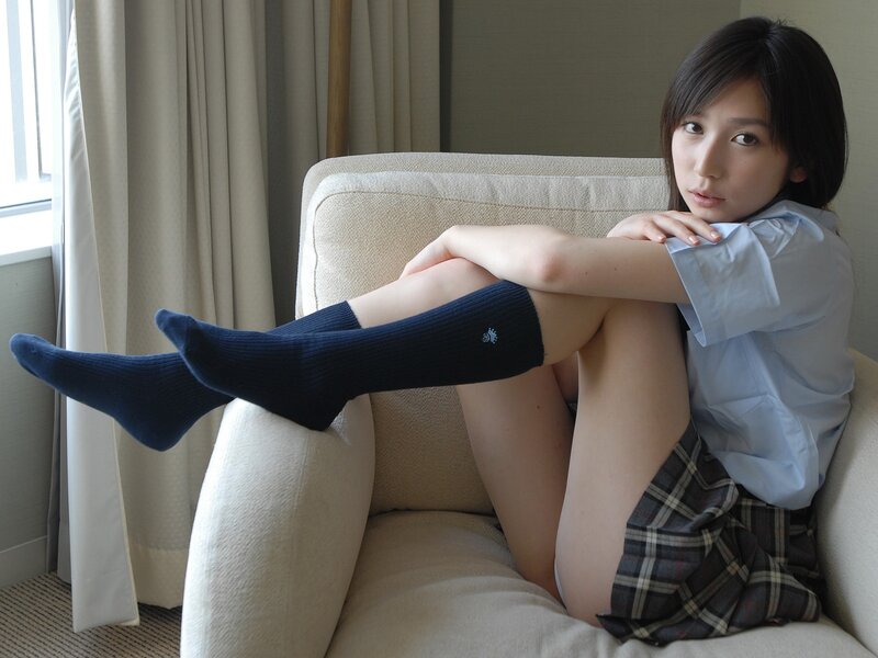 woman in school uniform sitting