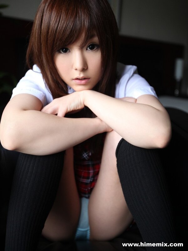 woman in school uniform sitting