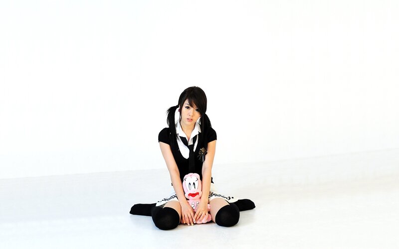woman in school uniform sitting