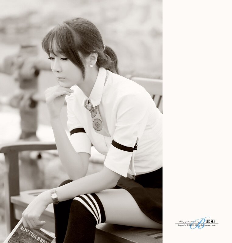 woman in school uniform sitting