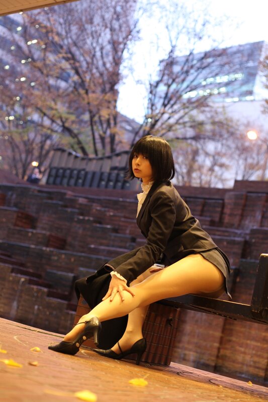 woman in school uniform sitting