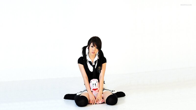 woman in school uniform sitting