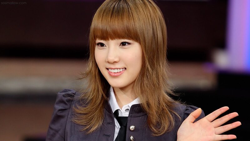 woman in school uniform smiling