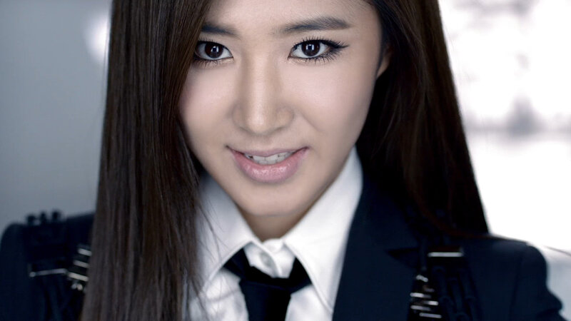 woman in school uniform smiling