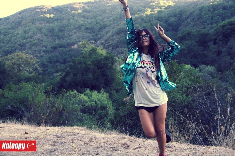 woman in sequin jacket outdoors
