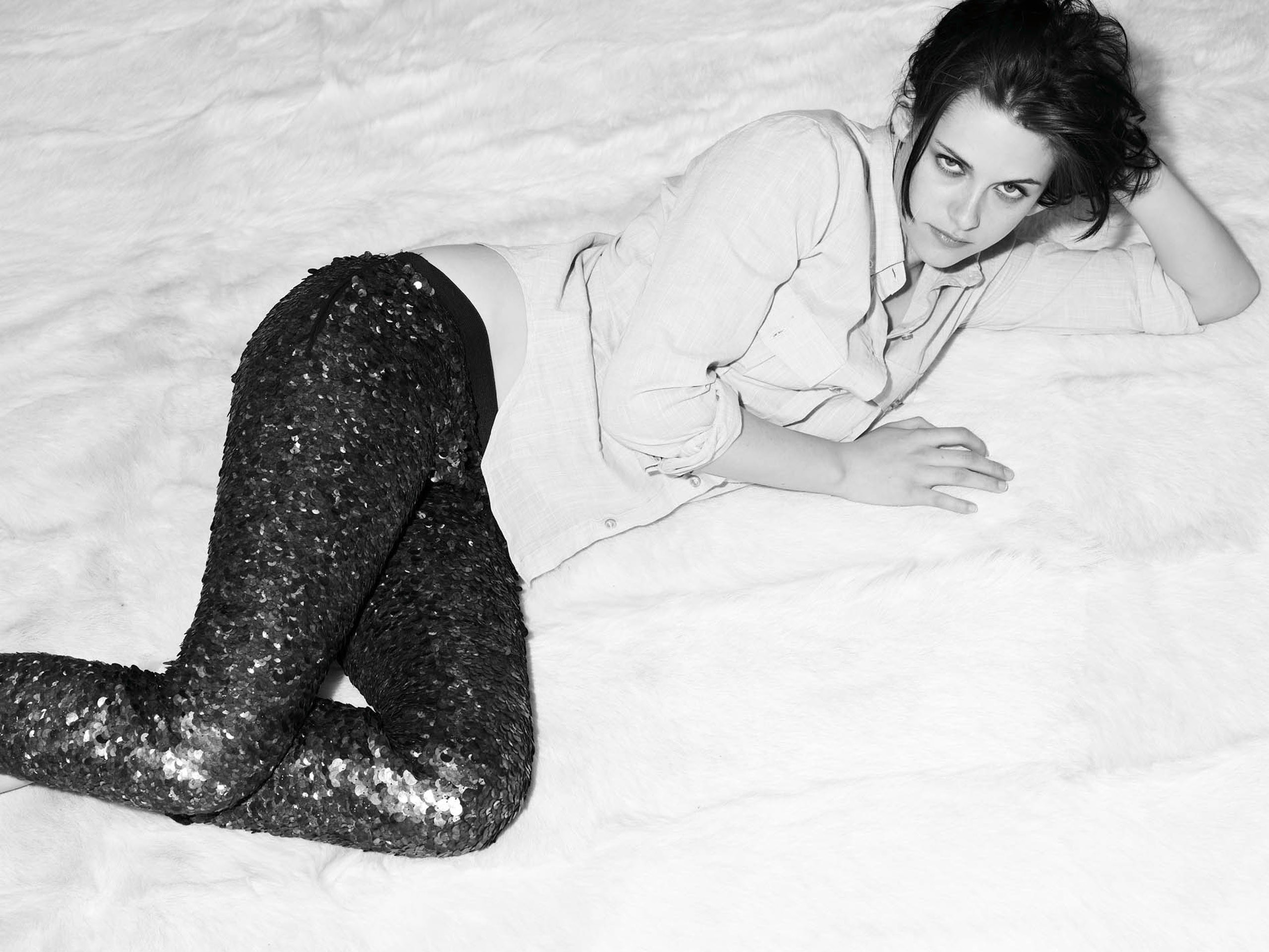 woman in sequin pants lying down
