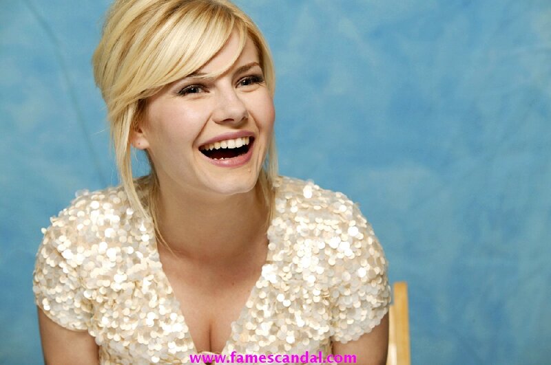 woman in sequin top laughing