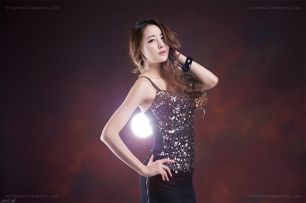 woman in sequin top posing