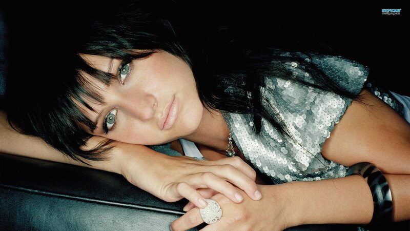 woman in sequin top resting