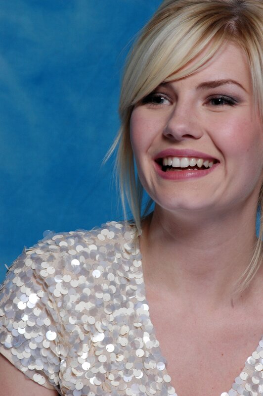 woman in sequin top smiling