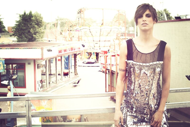 Woman in sequined dress at carnival